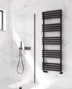 Close up of a large 3 bar black towel radiator in a bathroom showcasing the deep matte finish and modern style they can add